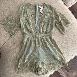 Lace romper with scalloped hems